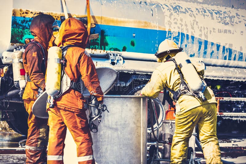 Firemen in firefighter uniform are checking their equipment after use. stock photography Firemen in firefighter uniform are checking their equipment after use. stock photography