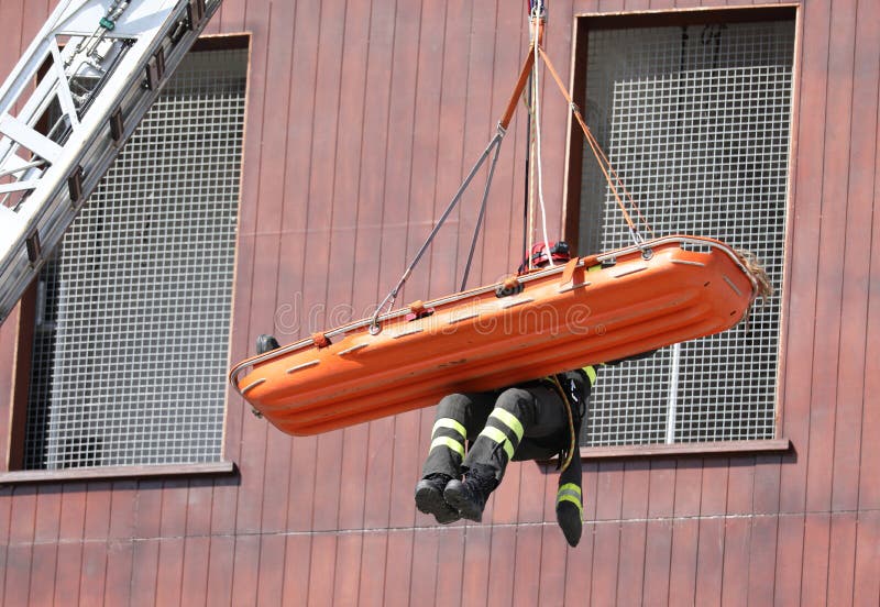 Firemen during a rescue with stretcher