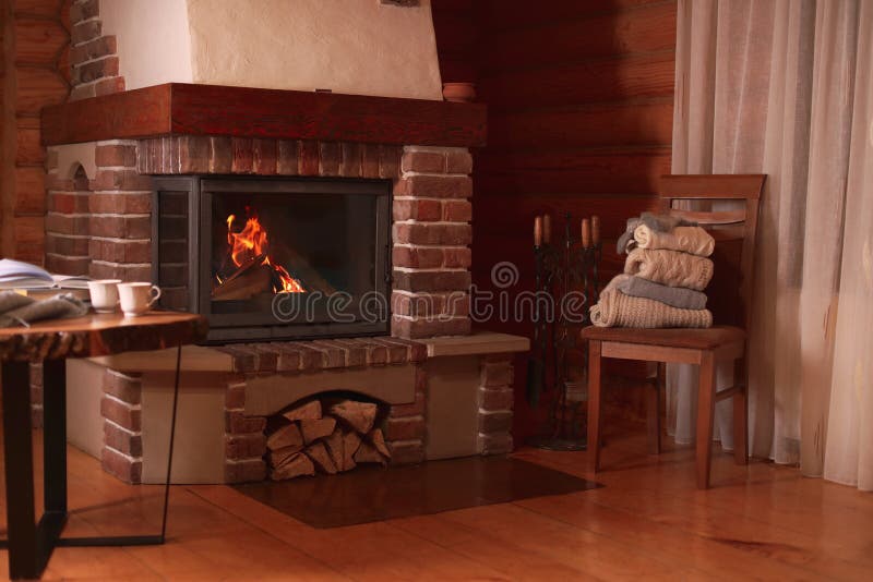 Fireplace with burning wood. Winter vacation