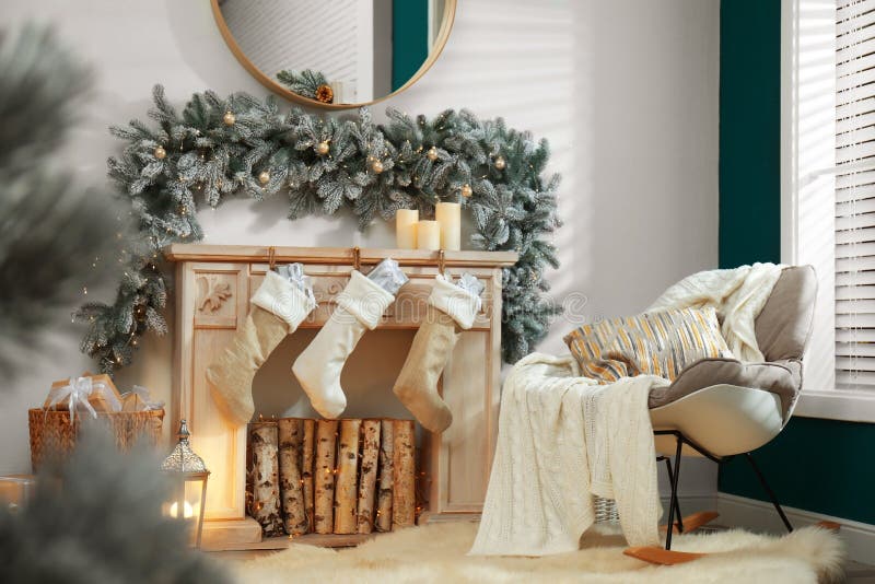 Fireplace with Christmas Stockings in Festive Interior Stock Image