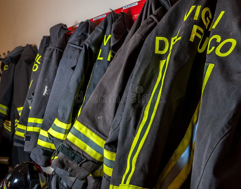 Firemen suits and helmets stock image. Image of firefighter 23504007