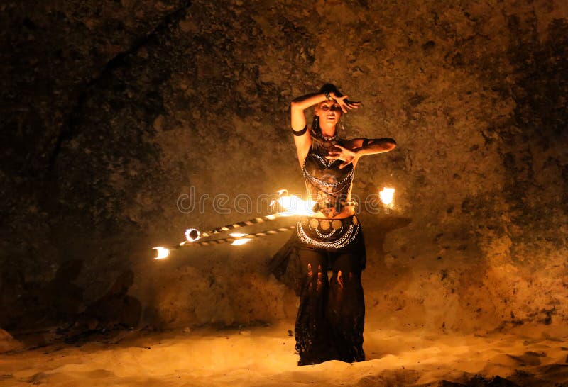 Fireshow artist dancing with fire ring