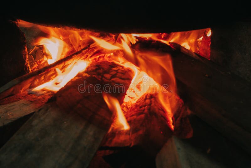 Firewood Burns Inside the Fireplace with Fire and Smoke Stock Photo