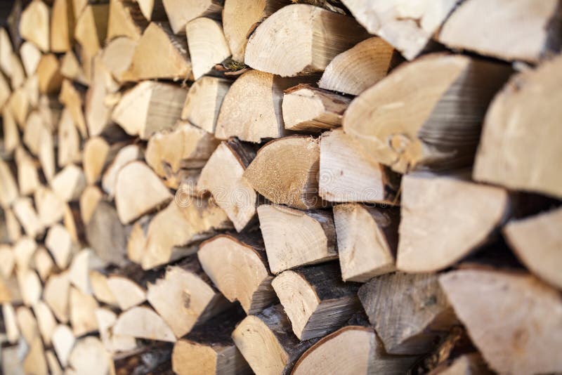 Firewood stack of natural wood background