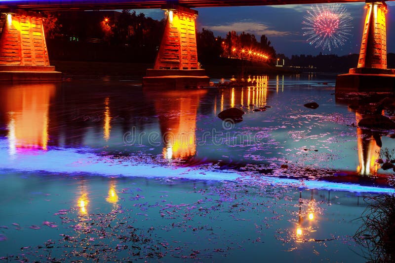 Firework over bridge night city reflected in water Uzhorod royalty free stock photos Firework over bridge night city reflected in water Uzhorod royalty free stock photos