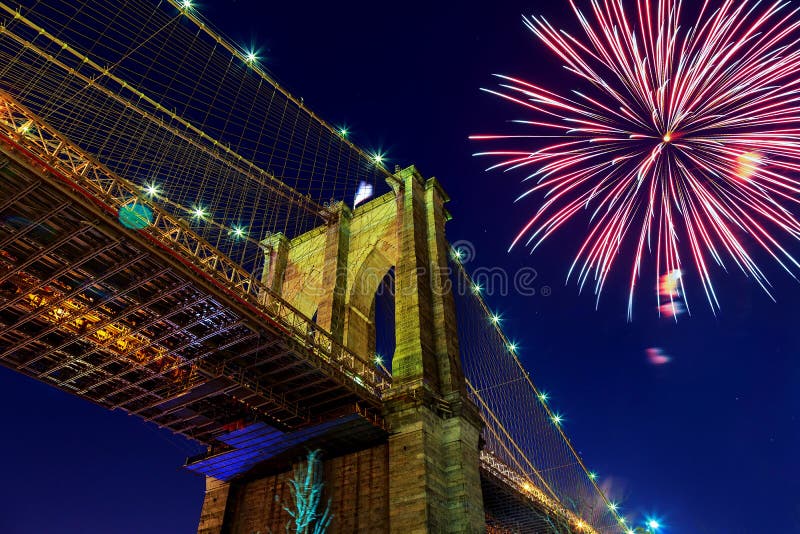 Firework over city at night with reflection in water