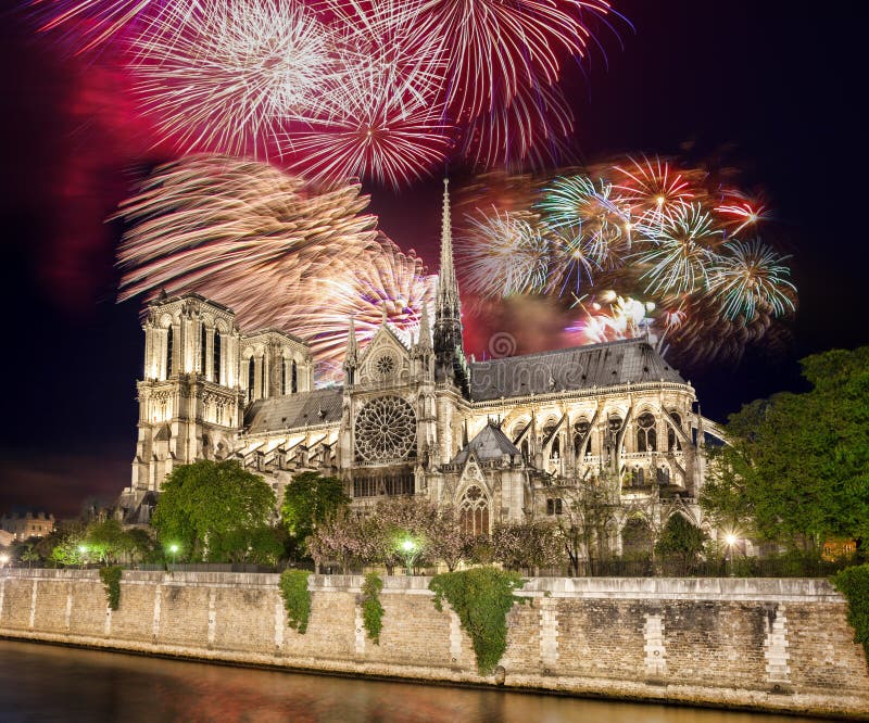 Beautiful firework over Notre Dame cathedral in Paris, France