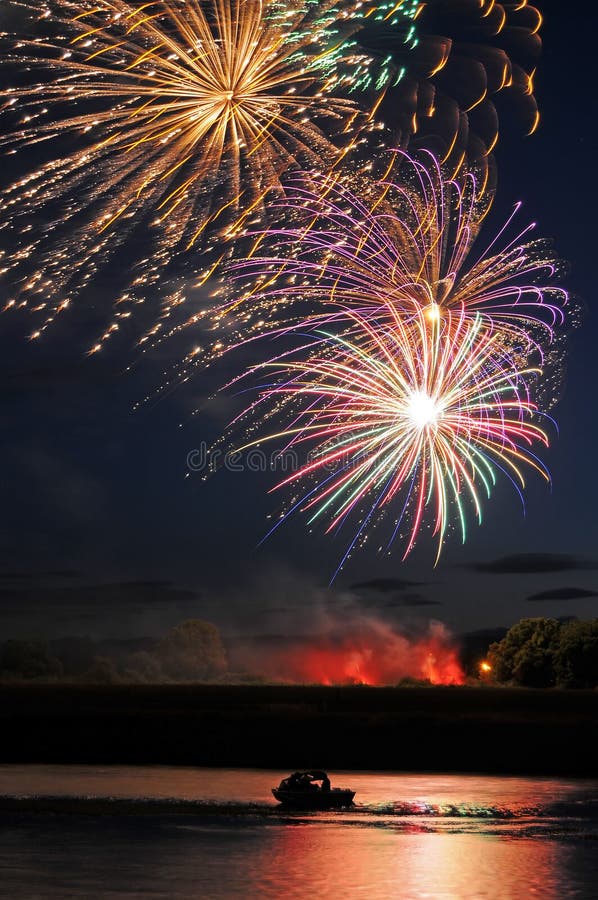 Fireworks Above Boat and River