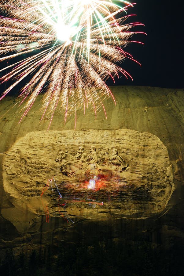 Fireworks explode over Stone Mountain, Georgia. Fireworks explode over the carvings of Confederate Generals at Stone Mountain, Georgia royalty free stock photo