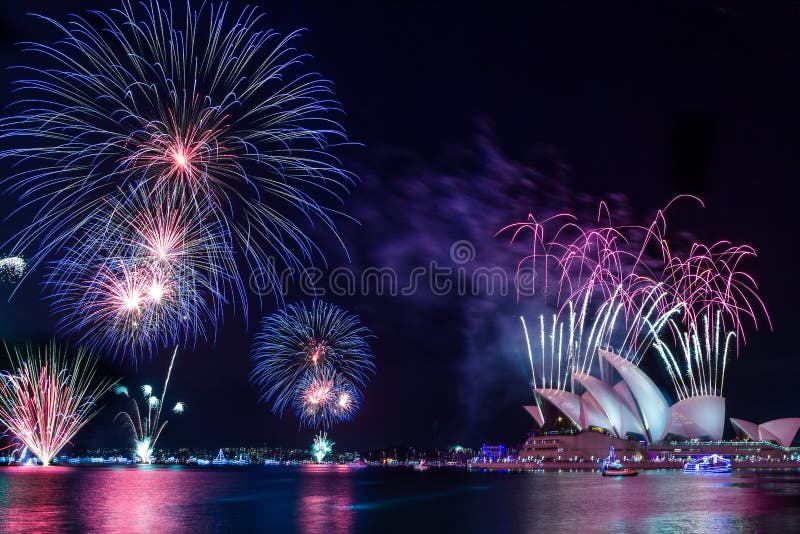 Fireworks exploding above the harbour of Sydney over the opera house