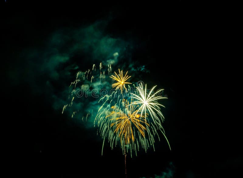 Fireworks Exploding Over the Mountains at night in Colorado stock image