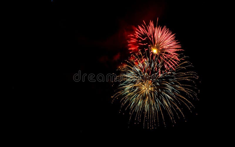 Fireworks Exploding Over the Mountains at night in Colorado stock photos