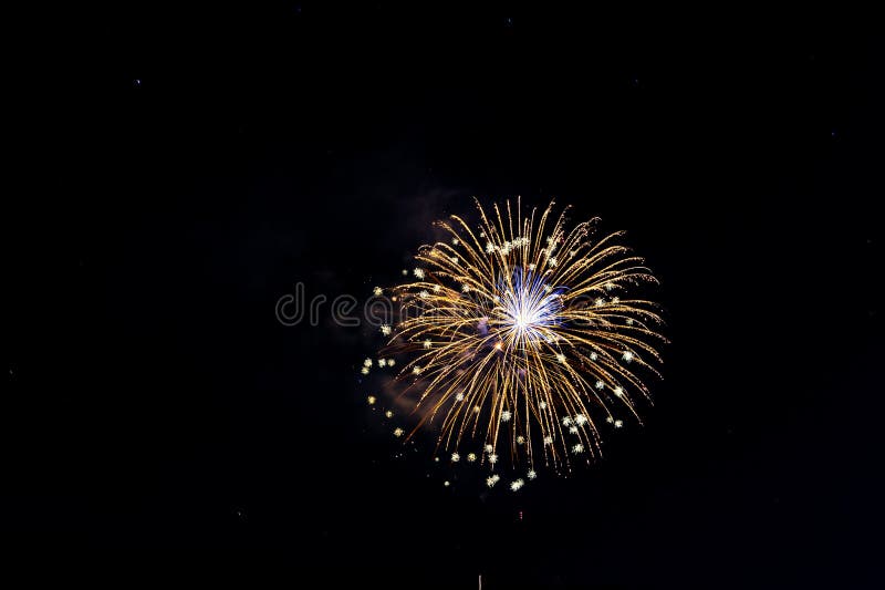 Fireworks Exploding Over the Mountains at night in Colorado royalty free stock photo