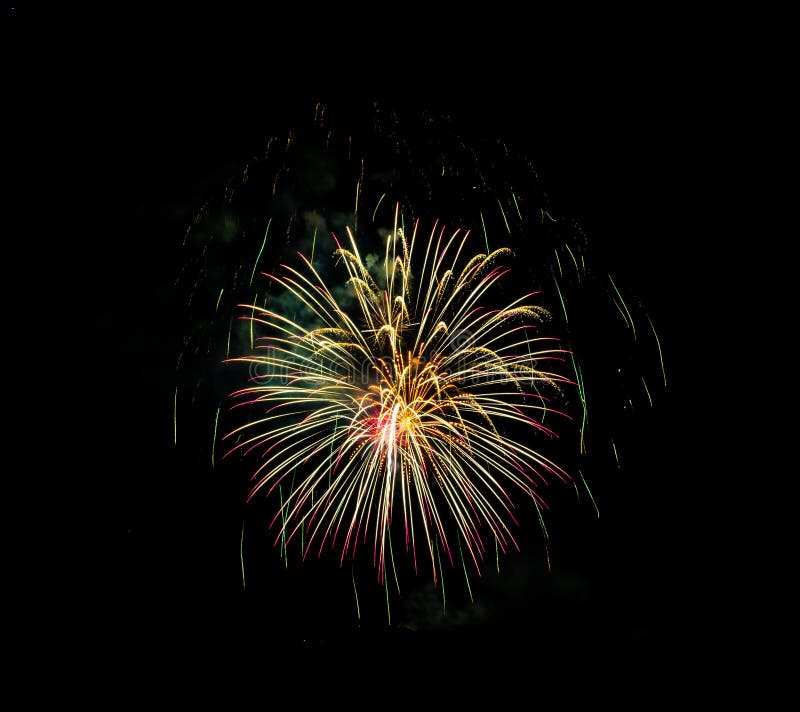 Fireworks Exploding Over the Mountains at night in Colorado royalty free stock photography