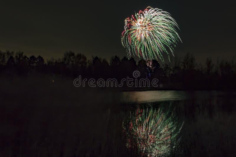 Fireworks Exploding Over Woodland Pond. Stock Photo Image of woodland
