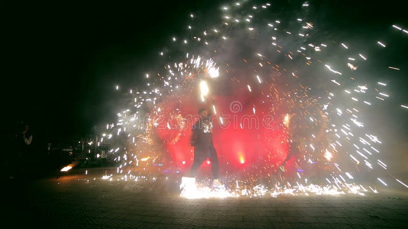 Fireworks. Fire show with dancing girl and man. Amazing at night stock footage Fireworks. Fire show with dancing girl and man. Amazing at night stock footage