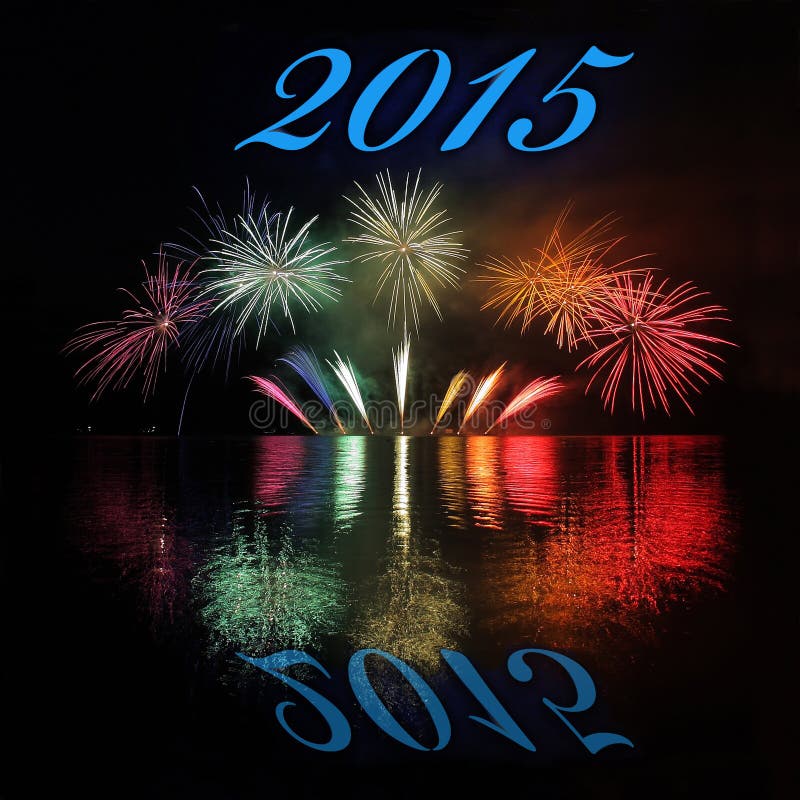 Happy New Year 2015 with fireworks on lake