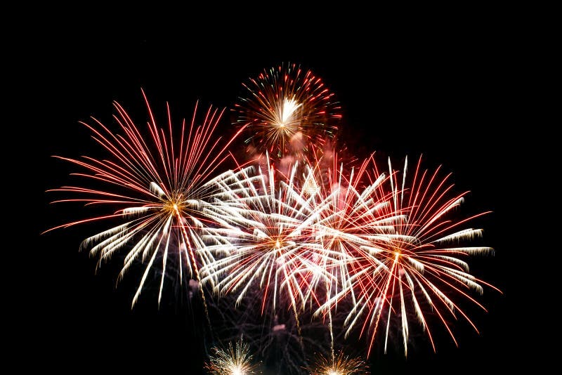 Fireworks light up in the night sky, dazzling scene royalty free stock image