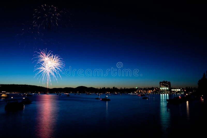 Fireworks over Lake at Twilight stock photo Fireworks over Lake at Twilight stock photo