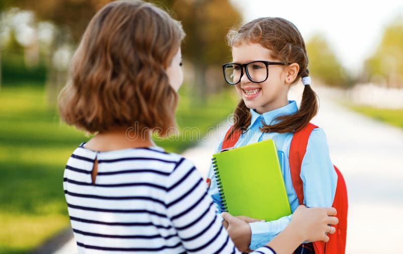 First day at school. mother leads little child school girl in first grade stock photography First day at school. mother leads little child school girl in first grade stock photography