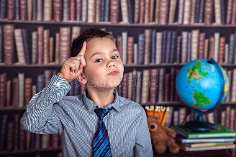 First Grader Thoughtfully Rubbing His Head Stock Photos Free
