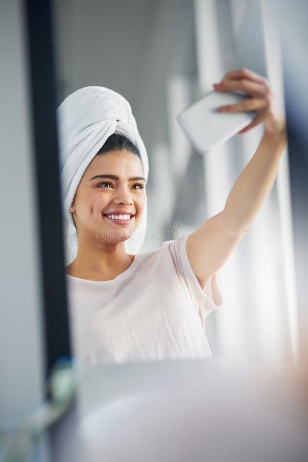 First Let Me Take A Selfie A Beautiful Young Woman Taking Selfies In The Bathroom At Home 