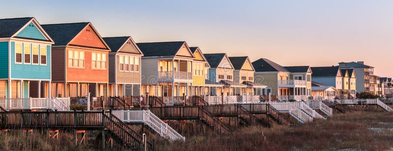 First light on row of colourful beach houses. Row of colourful beach houses along the ocean shoreline in Myrtle Beach stock photos First light on row of colourful beach houses. Row of colourful beach houses along the ocean shoreline in Myrtle Beach stock photos