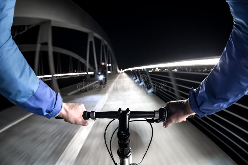 First-person view of cyclist at night royalty free stock images
