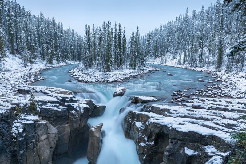 First snow Morning in Jasper National Park Alberta Canada Snow-covered winter landscape in the Sunwapta Falls on Athabasca river.