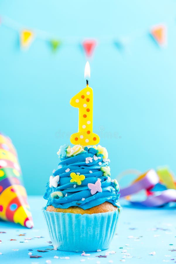 First 1st birthday cupcake with candle and sprinkles. Card mockup. stock photos First 1st birthday cupcake with candle and sprinkles. Card mockup. stock photos