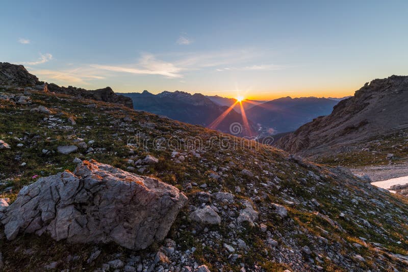 First sun glowing the Alps stock image. Image of dusk - 42658453