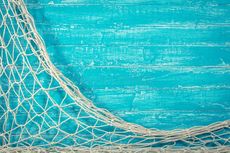 Fischernetz auf altem blauem Brett lizenzfreie stockbilder Fischernetz auf altem blauem Brett lizenzfreie stockbilder