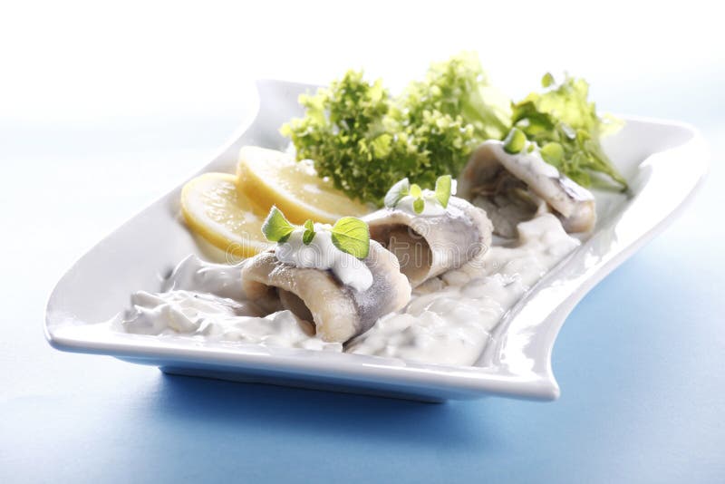 Fresh fish with cream sauce and lemon. Ceram stock images, royalty-free photos and pictures