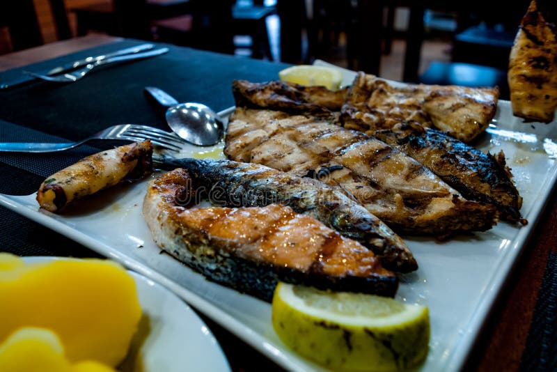 Fish Assortment, on a White Plate in a Restaurant of Lisbon. Stock