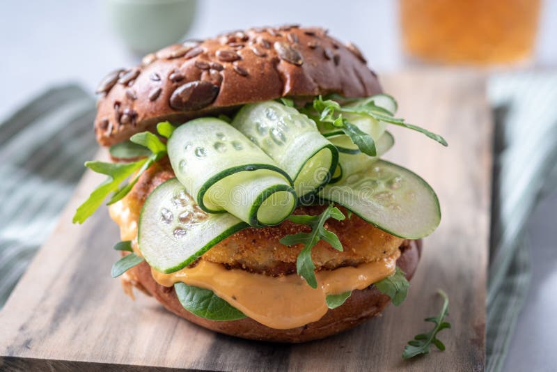 Fish burger with cucumber stock photo. Image of crab 183247024