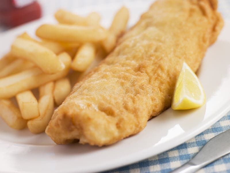 Fish and Chips with Lemon and Tomato Ketchup stock images Fish and Chips with Lemon and Tomato Ketchup stock images