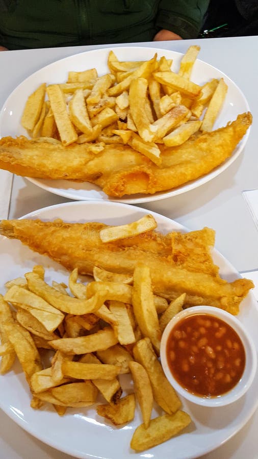 Fish and chips with potatoes royalty free stock photos