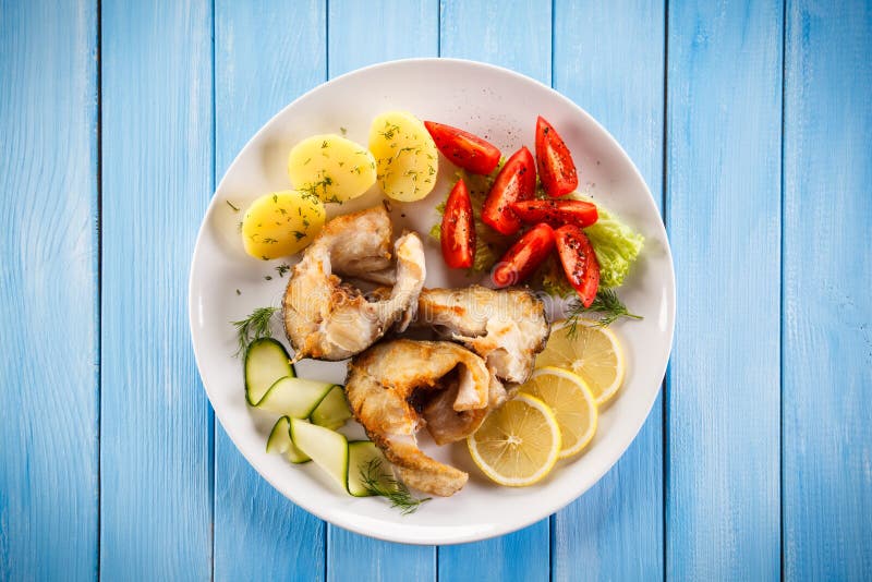 Fish dish - fried fish fillet and vegetables