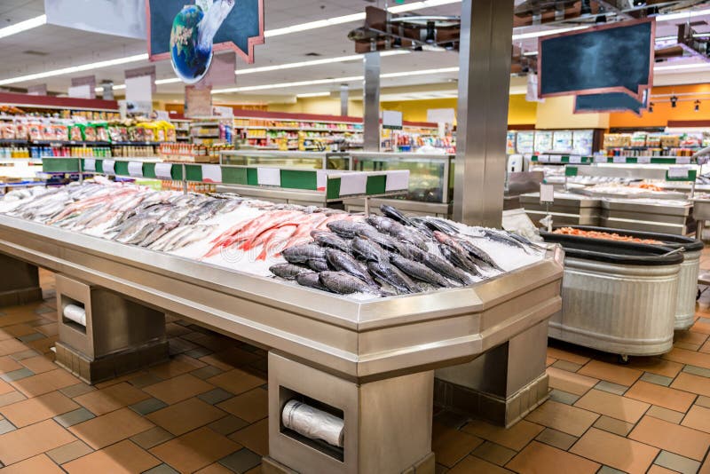 Fish displayed on ice at Supermarket seafood aisle