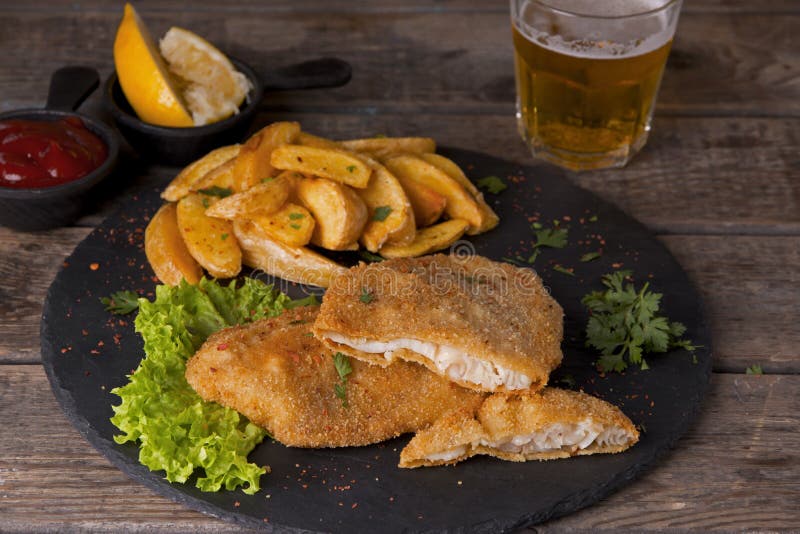 Fish Fillet Fried in Breadcrumbs with Potatoes Stock Image Image of potato, plate 101241643