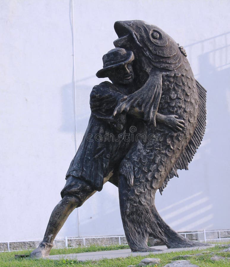 fish-fisherman-monument-obzor-bulgaria-fisherman-carrying-its-fish-monument-center-obzor-bulgaria-99355024.jpg