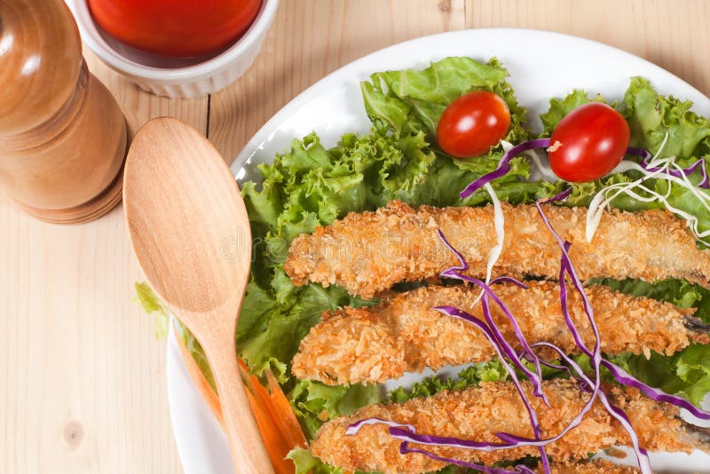 Fish fry in plate on wood stock photo. Image of stick 69074100