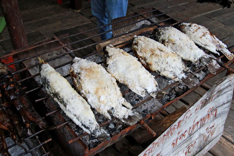Fish grilling on stove stock photo. Image of grate, grilled 46980608