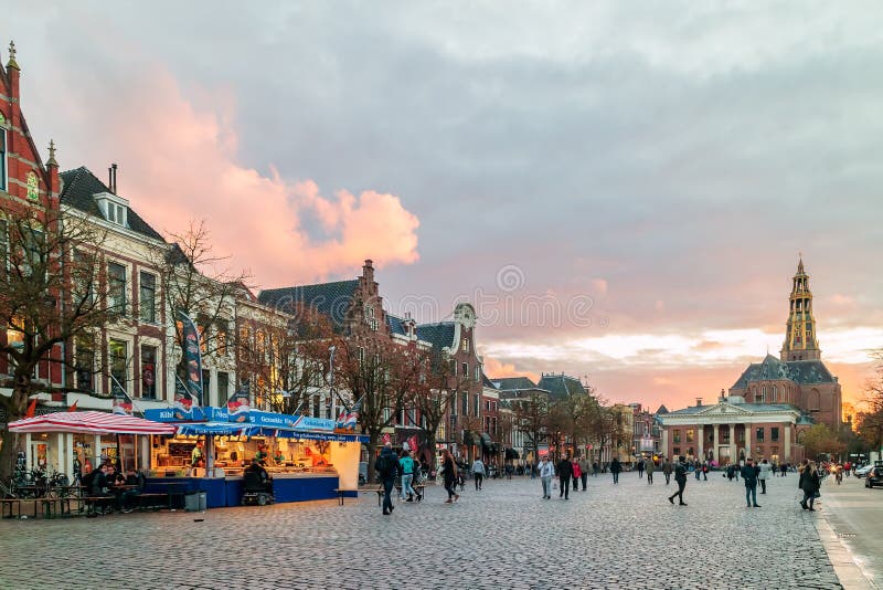 Fish market stall on the Dutch Vismarkt square during sunset in