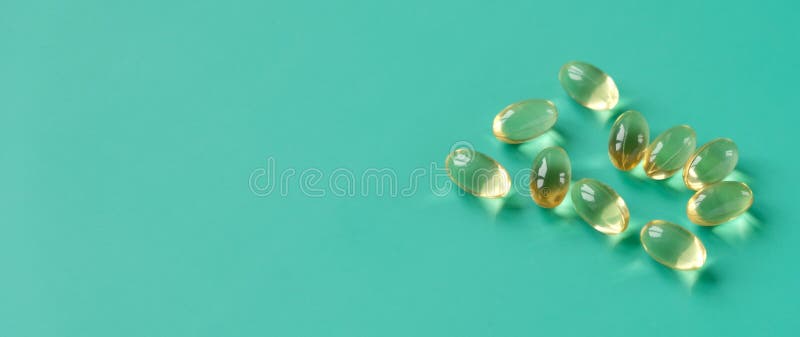 Fish Oil Capsules on a Blue Background. Omega-3 Stock Photo - Image of ...