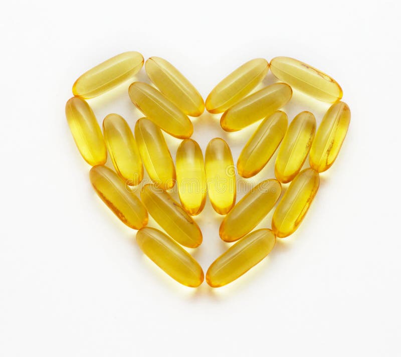 Cod Liver Fish Oil Supplements in a Healthy Heart Shape Stock Image