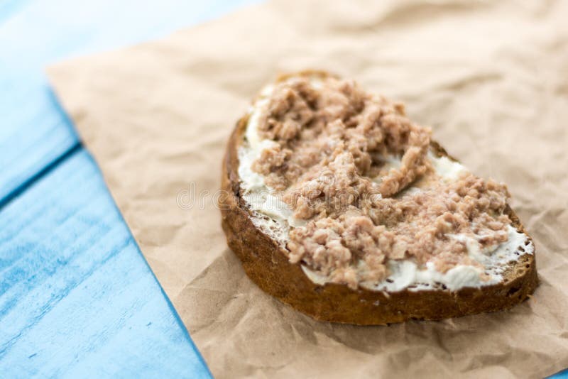Fish Pate Spread on a Slice of Bread on the Wrinkled Brown Paper Stock