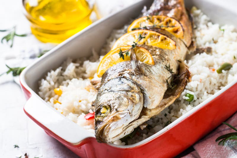 Fish Seabass Baked with Rice and Vegetables. Stock Image - Image of