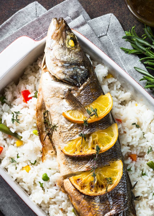 Fish Seabass Baked with Rice and Vegetables. Stock Image - Image of