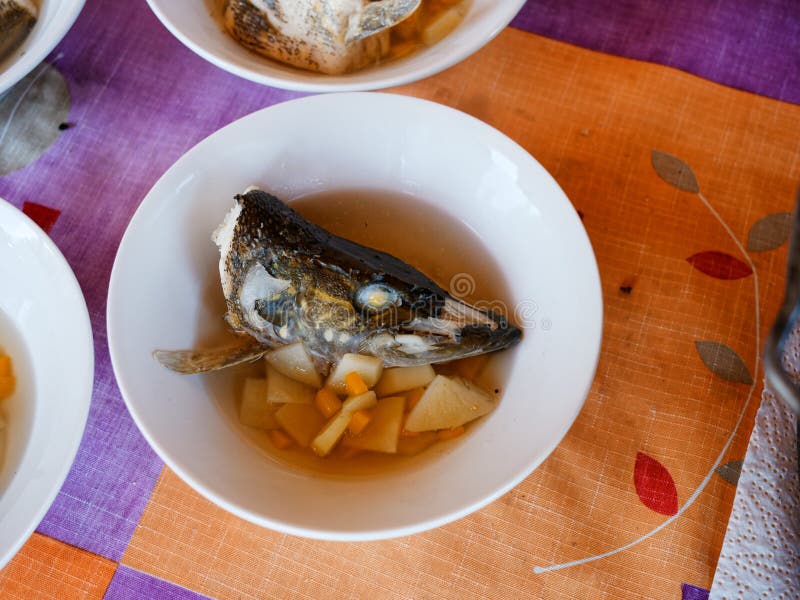 Fish Soup in a Plate with a Potato, Spices and Other Components Stock